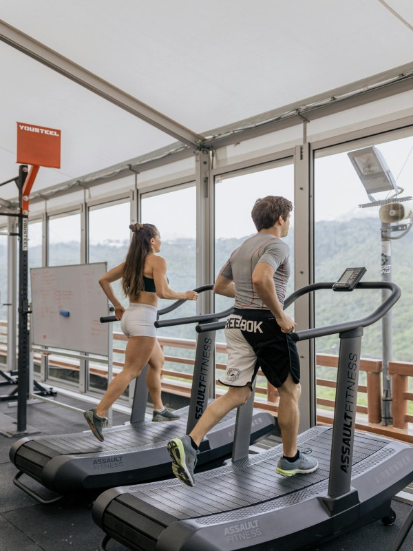 Couple Running Treadmill